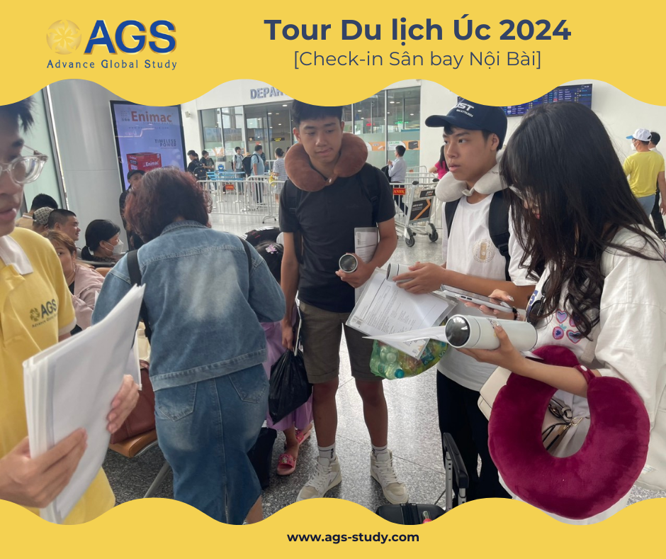 Travelers at Noi Bai Airport reviewing documents for the AGS Australia Tour 2024.